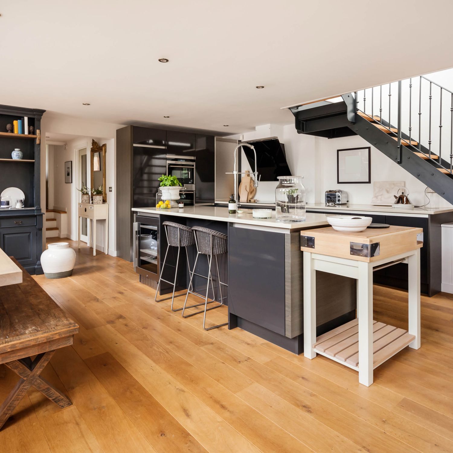 A nice, new hardwood floor shown in a modern kitchen.